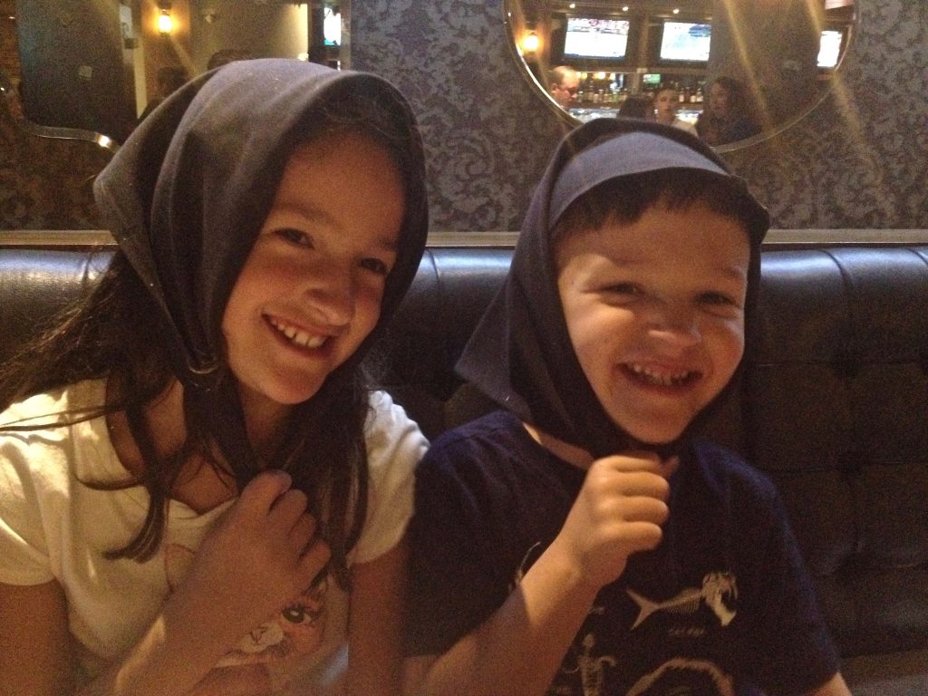 photo of kids with napkins on their heads