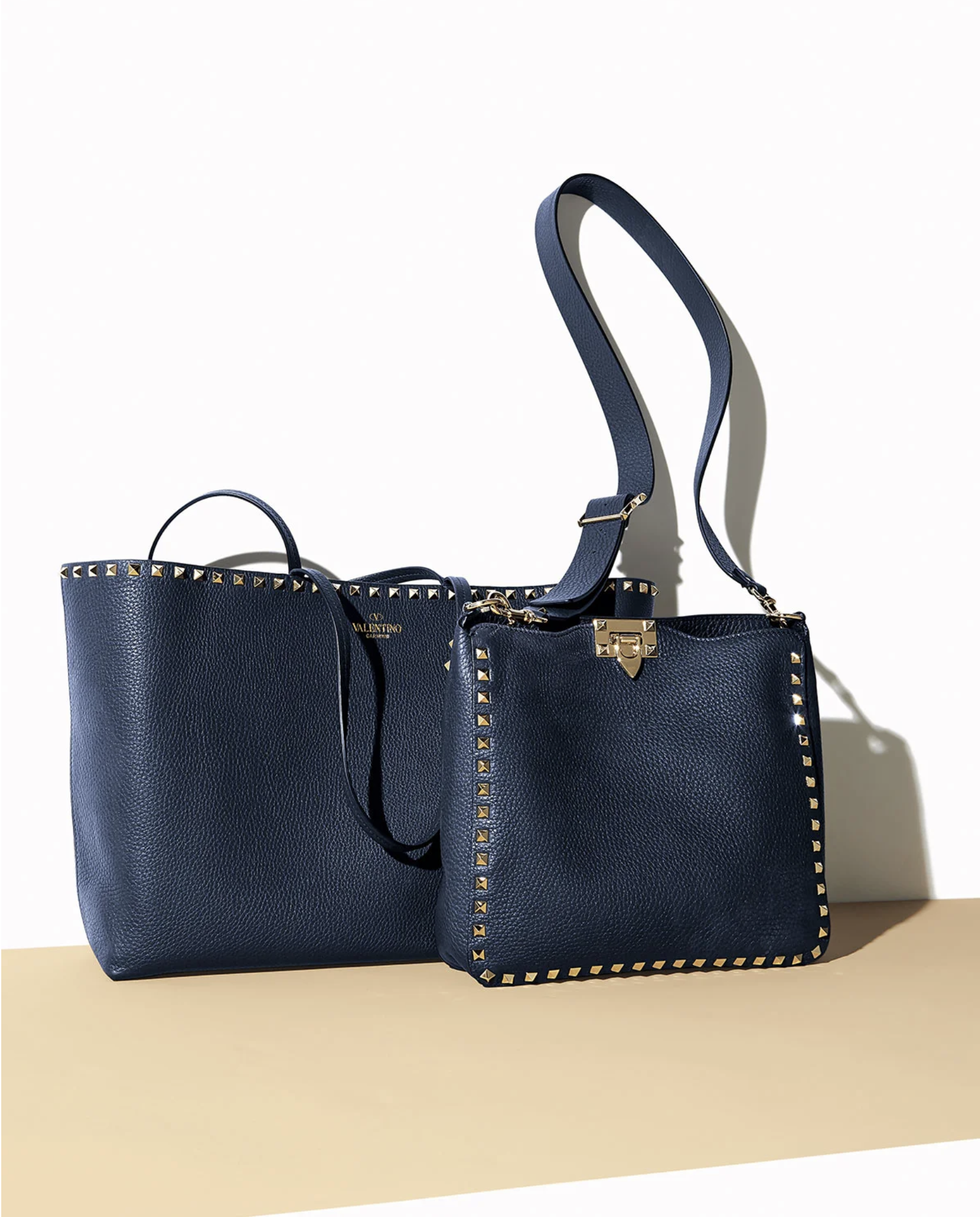 two navy blue Valentino Garavani Rockstud Tote Bags