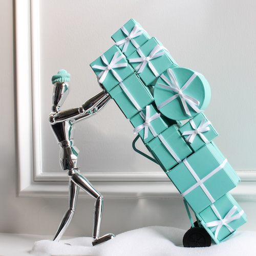 Shopping Tips figure pushing dolly of wrapped Tiffany boxes