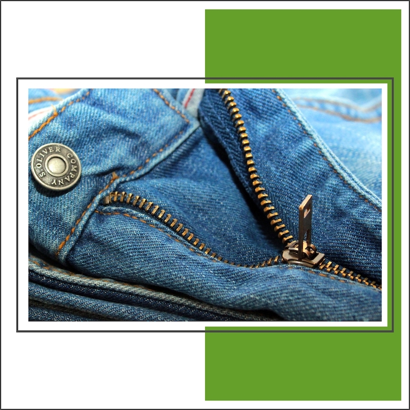 closeup of jeans top button and zipper