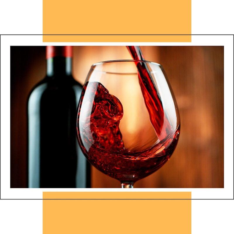 red wine splashing into wine glass