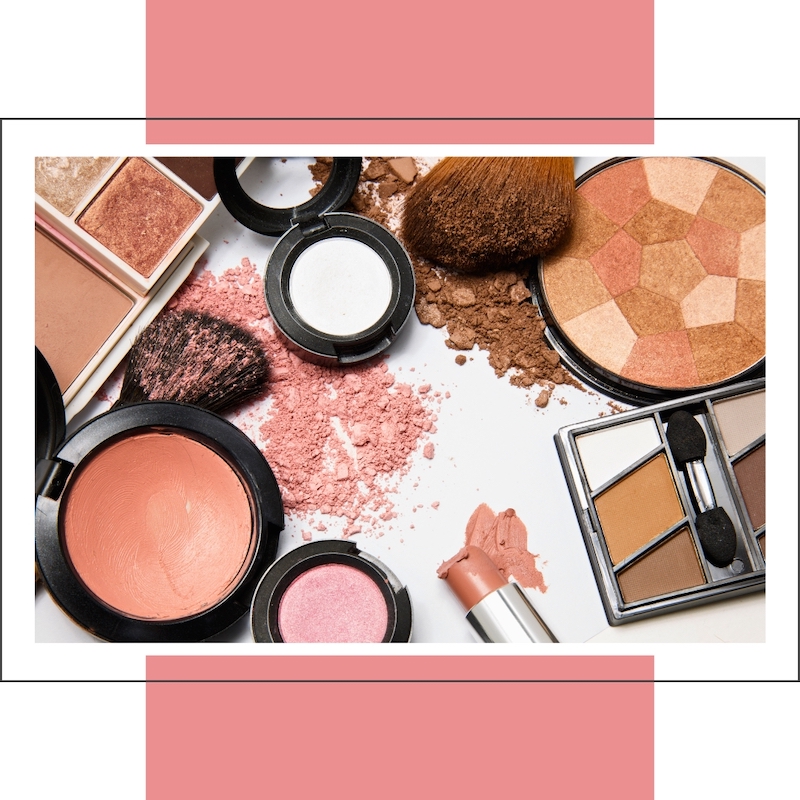 several compacts of makeup with crushed powder on table