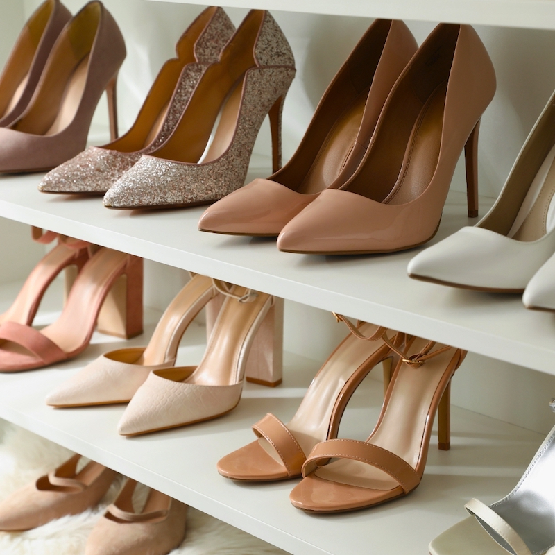 Neutral colored shoes on shelves