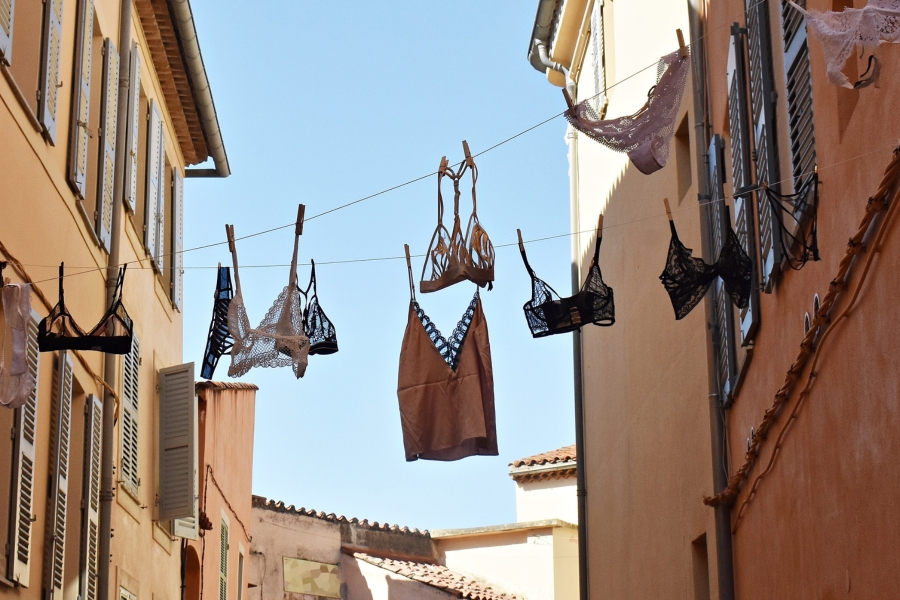 lingerie hanging on clothesline between Italian buildings